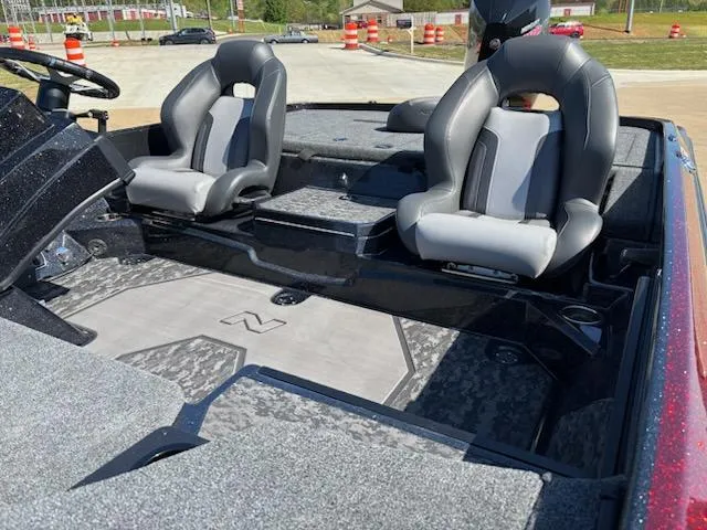 Slide: The Image of 2025 Nitro Z21 XL boat interior with two gray seats and carpeted flooring. - 4