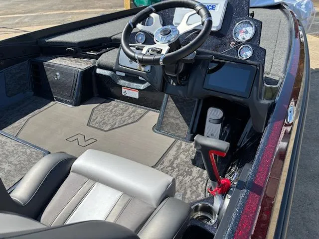 Slide: The Image of 2025 Nitro Z21 XL boat interior with steering wheel and dashboard controls. - 5
