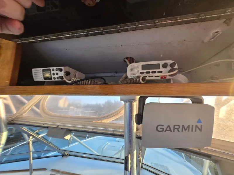 Slide: The Image of 1984 Topaz 36 Sportfisherman boat with Garmin equipment and communication radios. - 17