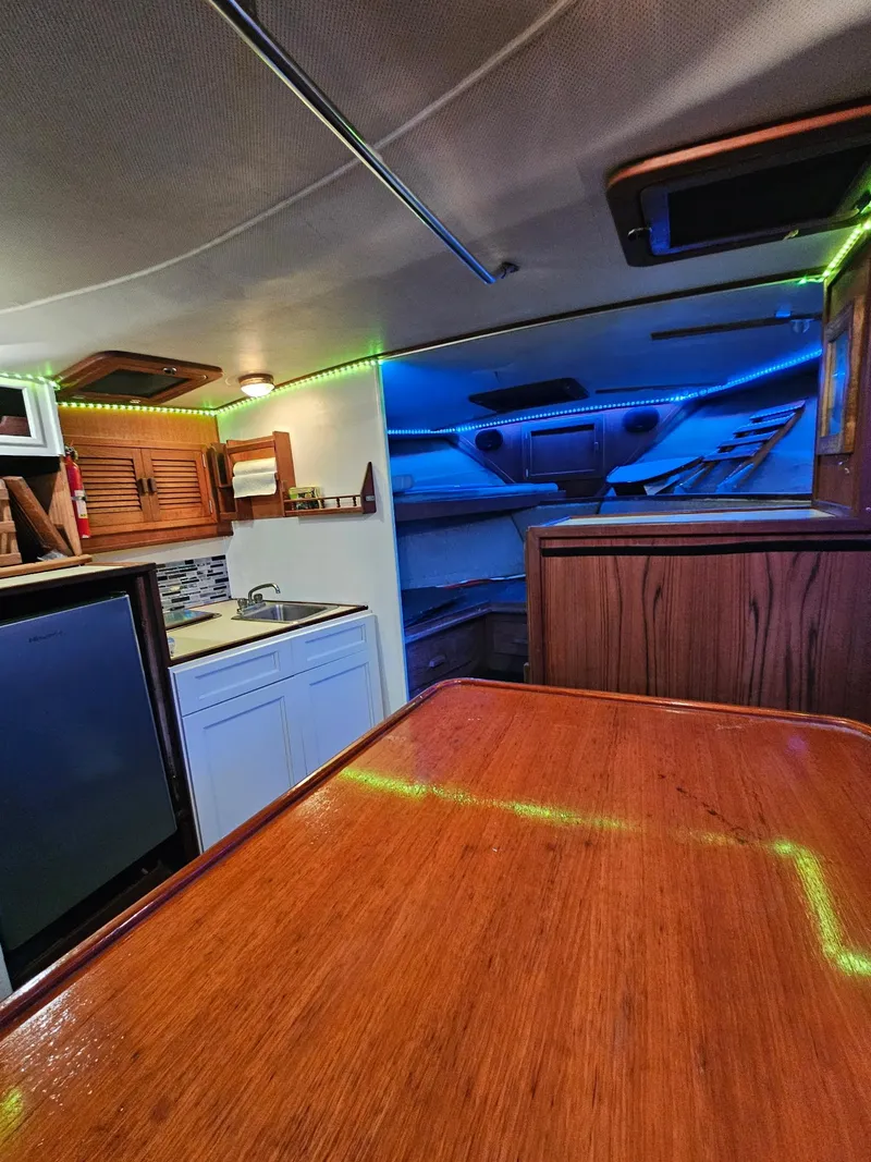 Slide: The Image of Interior of 1984 Topaz 36 Sportfisherman with wood finish and ambient lighting. - 4