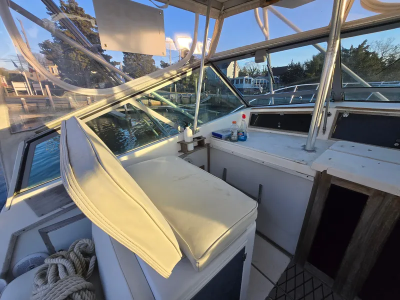 Slide: The Image of 1984 Topaz 36 Sportfisherman boat interior with helm station and seating. - 9