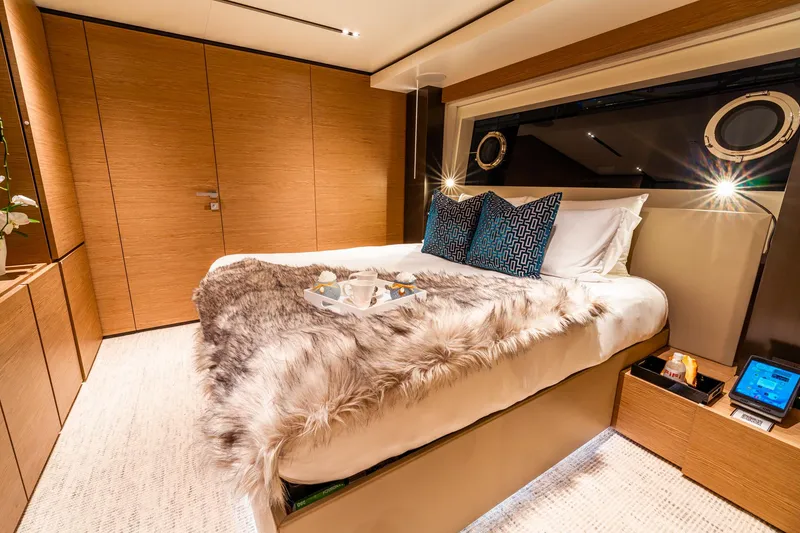 Slide: The Image of Luxurious bedroom in 2018 Custom Line Navetta 33 yacht with elegant decor and cozy bedding. - 45
