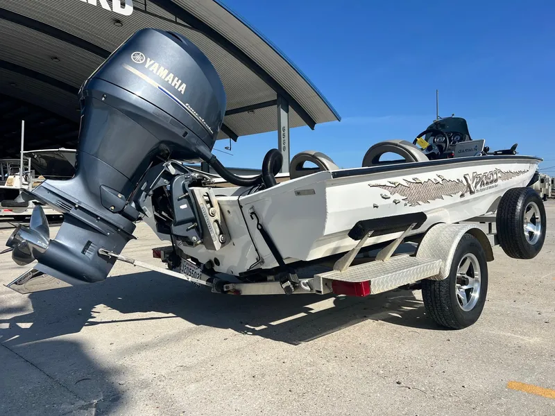 Slide: The Image of 2013 Express H18 boat with Yamaha outboard motor on a trailer. - 3