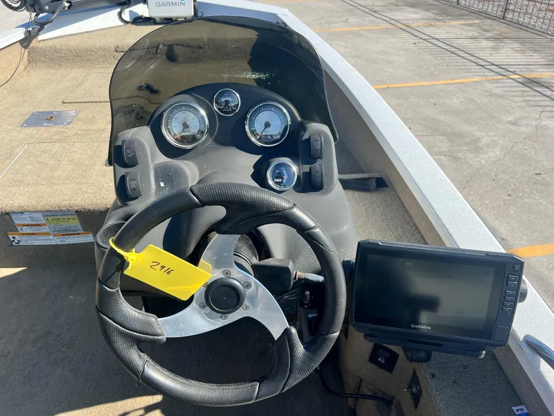 Slide: The Image of 2013 Express H18 boat dashboard with steering wheel and Garmin GPS. - 7