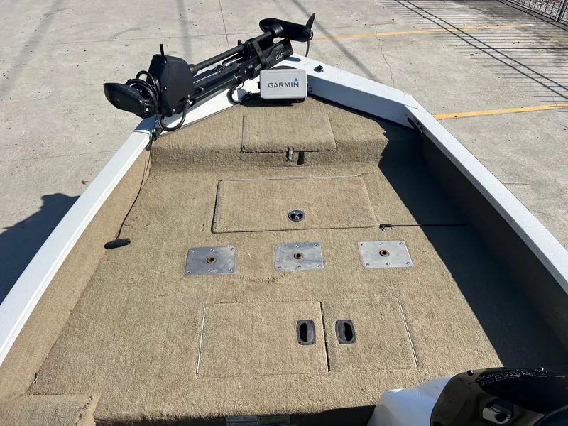 Slide: The Image of 2013 Express H18 boat deck with Garmin equipment and carpeted surface. - 8