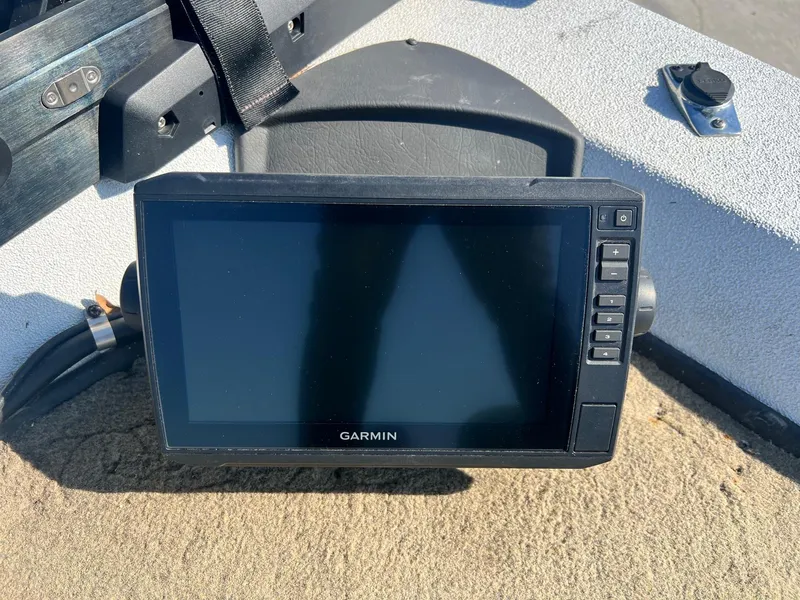 Slide: The Image of Garmin marine GPS device on Express H18 boat dashboard, 2013 model. - 9