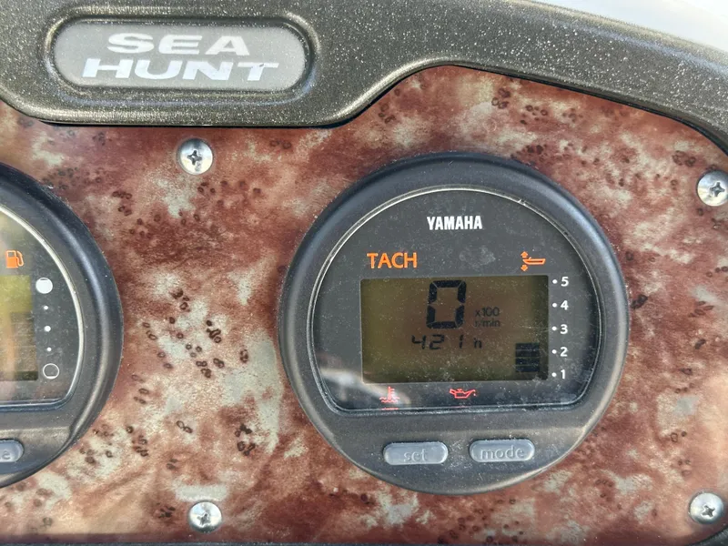 Slide: The Image of Dashboard of a 2013 Sea Hunt Ultra 225 boat with Yamaha tachometer display. - 29