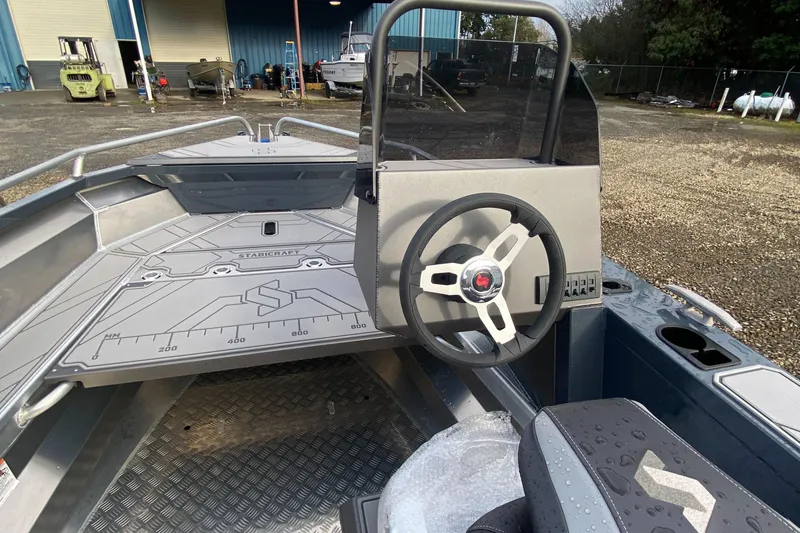 Slide: The Image of 2025 Stabicraft 1550 Frontier Adventure boat interior with steering wheel and dashboard. - 4
