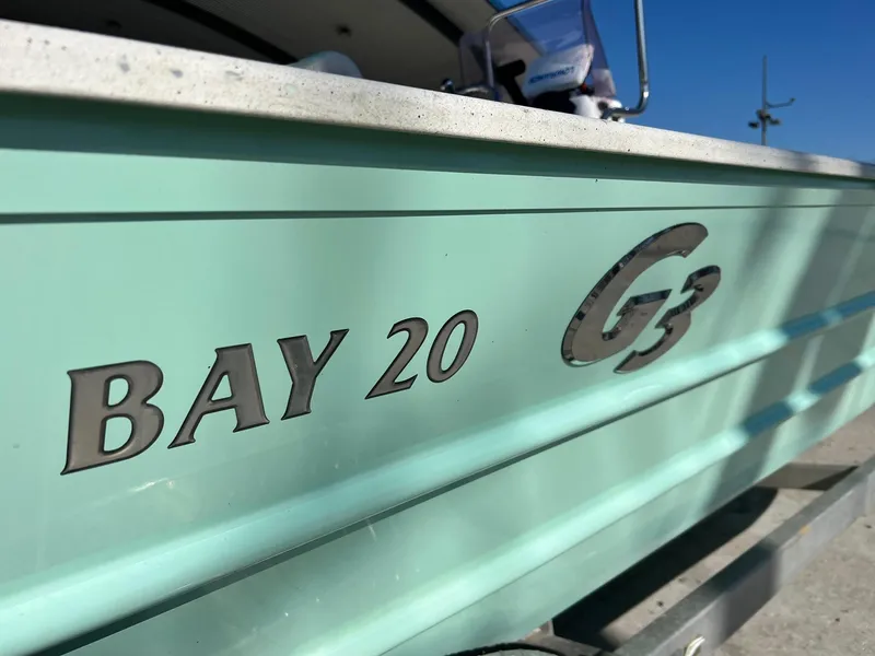 Slide: The Image of Close-up of 2019 G3 Bay 20 boat side with logo and name. - 2