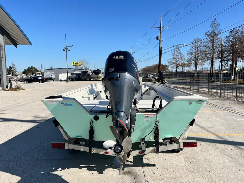 Slide: The Image of 2019 G3 Bay 20 boat with outboard motor on trailer in parking lot. - 4