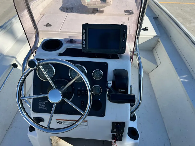 Slide: The Image of Boat console of 2019 G3 Bay 20 with steering wheel and navigation system. - 8