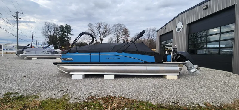Slide: The Image of 2025 Avalon Platinum Catalina 2785 Quad Lounger Shift pontoon boat displayed outdoors. - 12