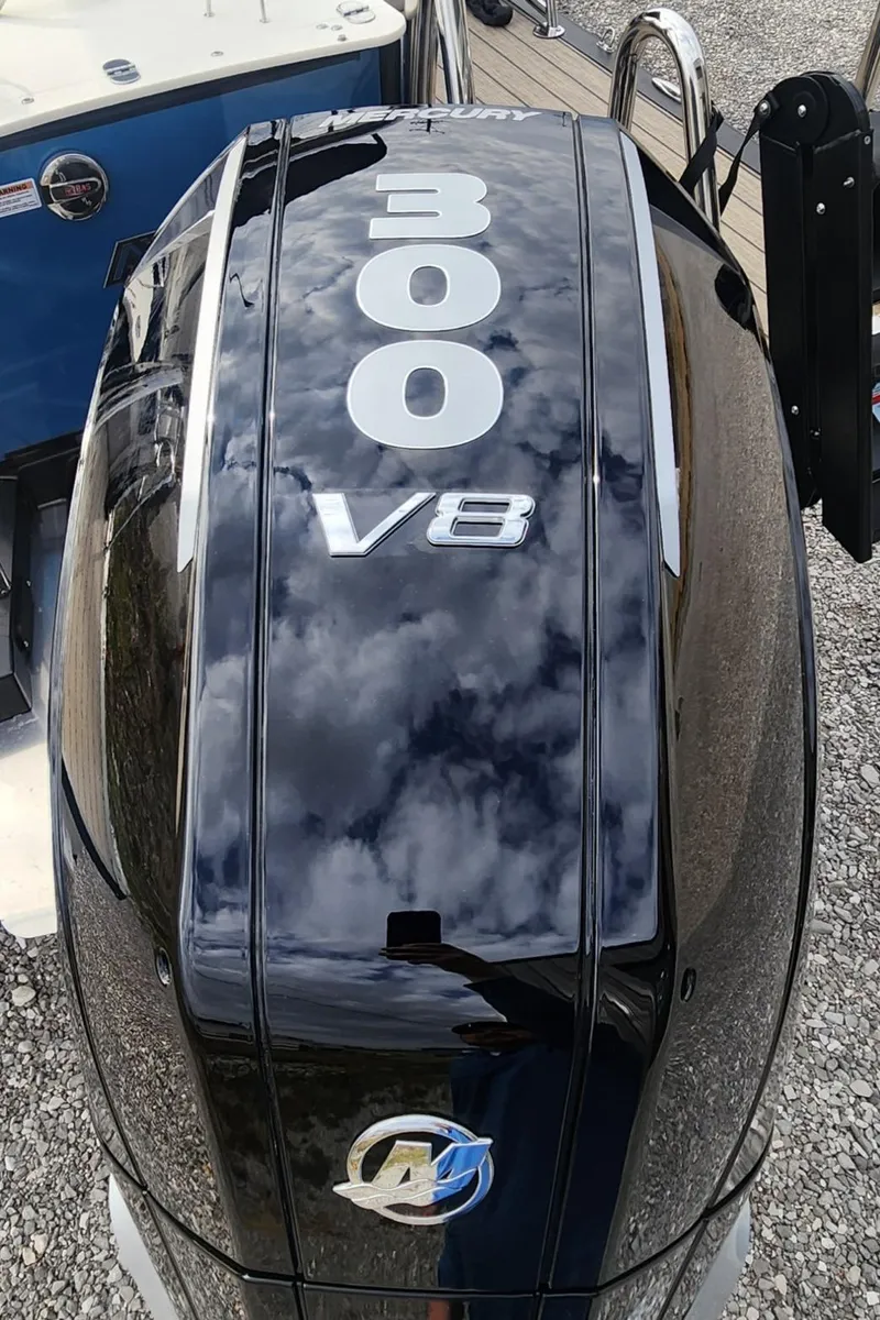 Slide: The Image of Outboard motor with "300 V8" branding on a 2025 Avalon Platinum Catalina 2785 Quad Lounger Shift. - 14
