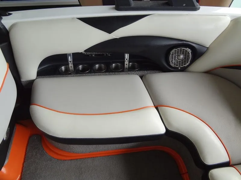 Slide: The Image of 2010 Malibu VLX WAKESETTER boat interior with stylish seating and speaker system. - 15
