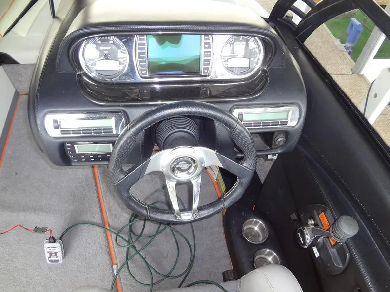 Slide: The Image of 2010 Malibu VLX Wakesetter dashboard with steering wheel and control panel. - 17