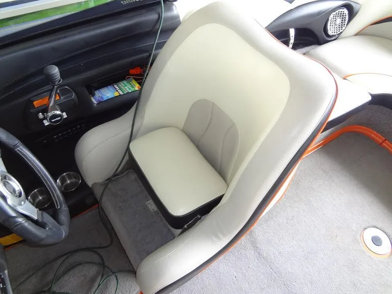 Slide: The Image of 2010 Malibu VLX WAKESETTER interior with beige seat and control panel. - 18