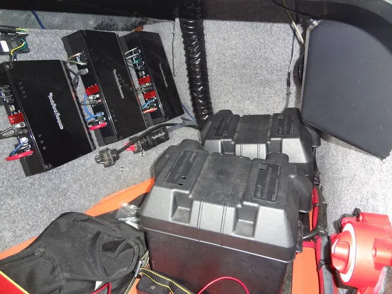 Slide: The Image of 2010 Malibu VLX WAKESETTER boat audio system with amplifiers and battery setup. - 21