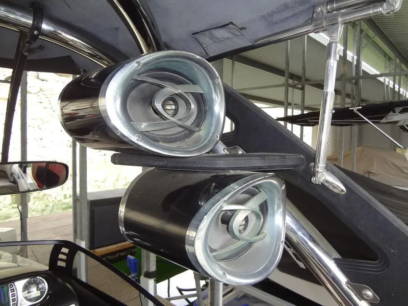Slide: The Image of 2010 Malibu VLX WAKESETTER boat speakers and tower detail in a garage setting. - 23