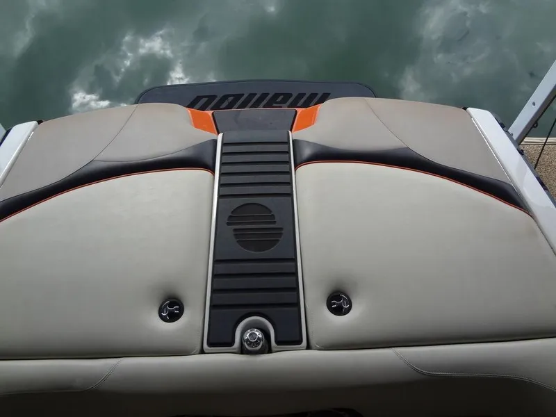 Slide: The Image of 2010 Malibu VLX WAKESETTER boat interior with sleek design and cushioned seating. - 25