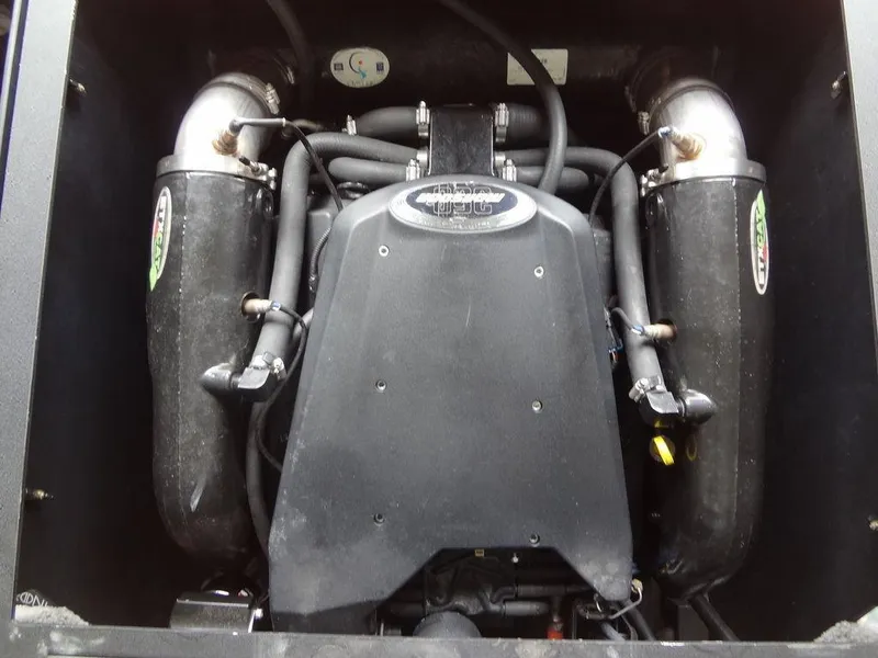 Slide: The Image of Engine of 2010 Malibu VLX WAKESETTER boat, showcasing intricate mechanical components. - 28