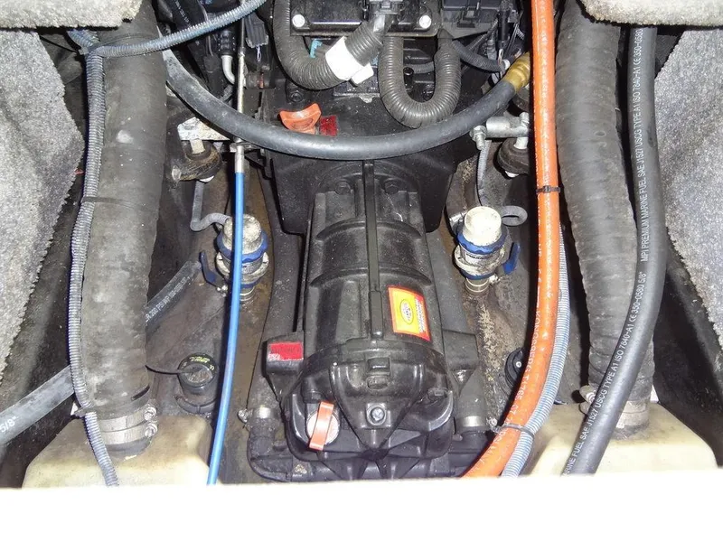 Slide: The Image of 2010 Malibu VLX WAKESETTER engine compartment with visible hoses and components. - 29