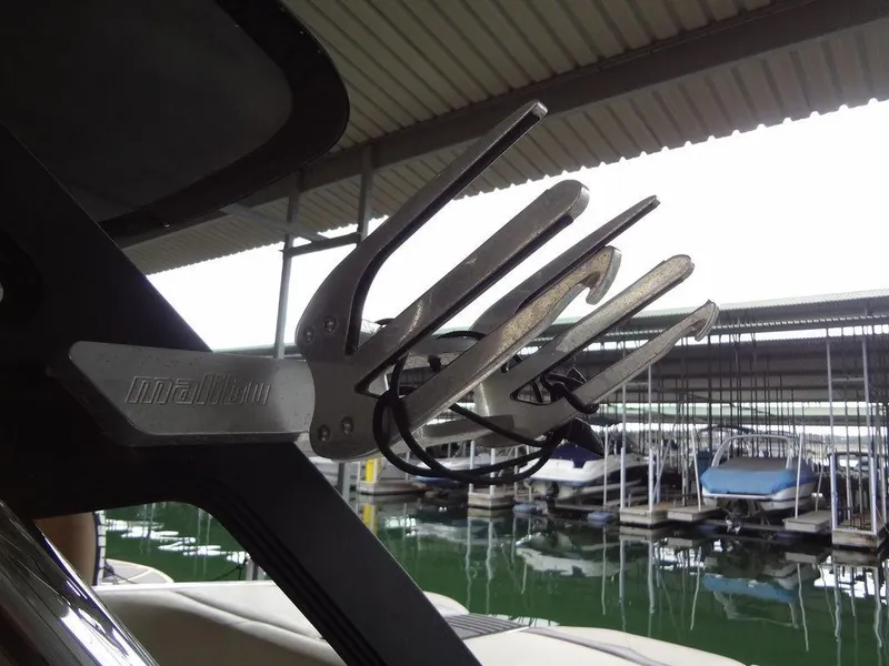 Slide: The Image of 2010 Malibu VLX WAKESETTER boat rack in marina setting. - 34