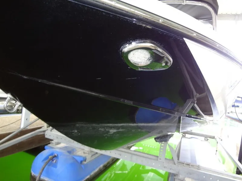 Slide: The Image of 2010 Malibu VLX WAKESETTER boat hull on trailer, close-up view. - 35