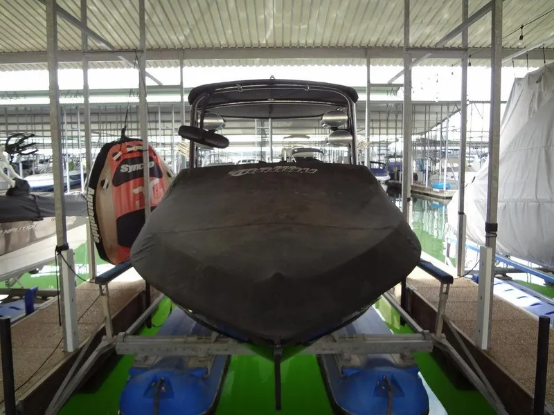 Slide: The Image of 2010 Malibu VLX WAKESETTER boat docked in covered marina. - 37