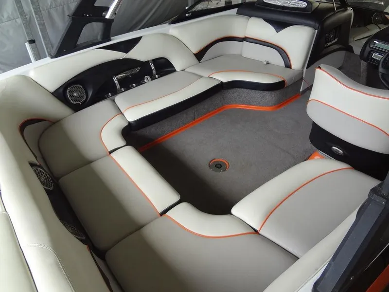 Slide: The Image of 2010 Malibu VLX WAKESETTER interior with sleek seating and modern design. - 8