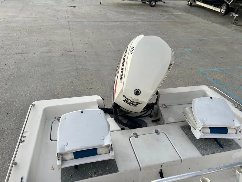 Slide: The Image of 2000 Pathfinder 2200 boat with Evinrude outboard motor in parking lot. - 4