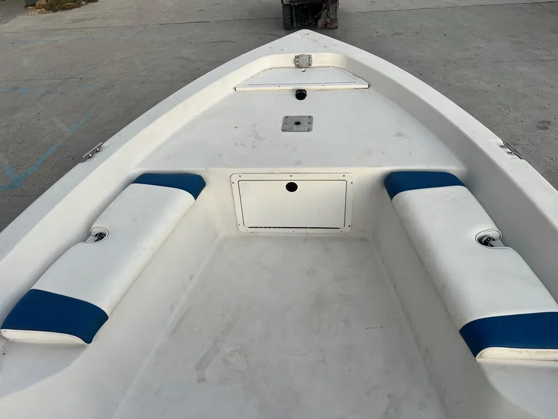 Slide: The Image of 2000 Pathfinder 2200 boat interior with white and blue seating. - 6