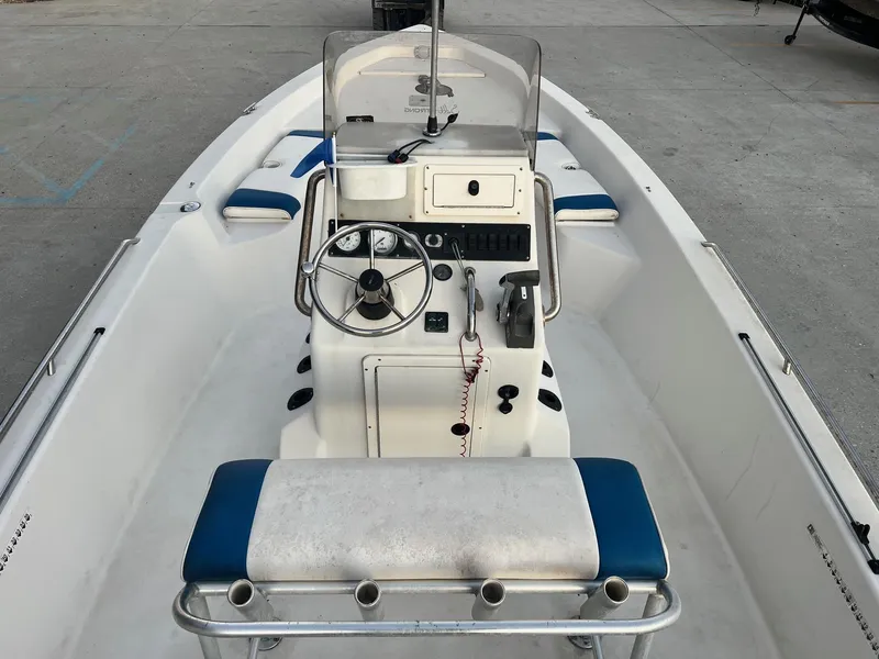 Slide: The Image of 2000 Pathfinder 2200 boat interior with steering console and seating. - 8