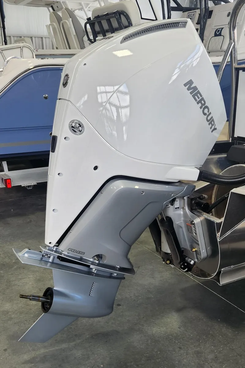 Slide: The Image of 2025 Avalon Platinum Catalina 2585 with Mercury outboard motor in showroom. - 16