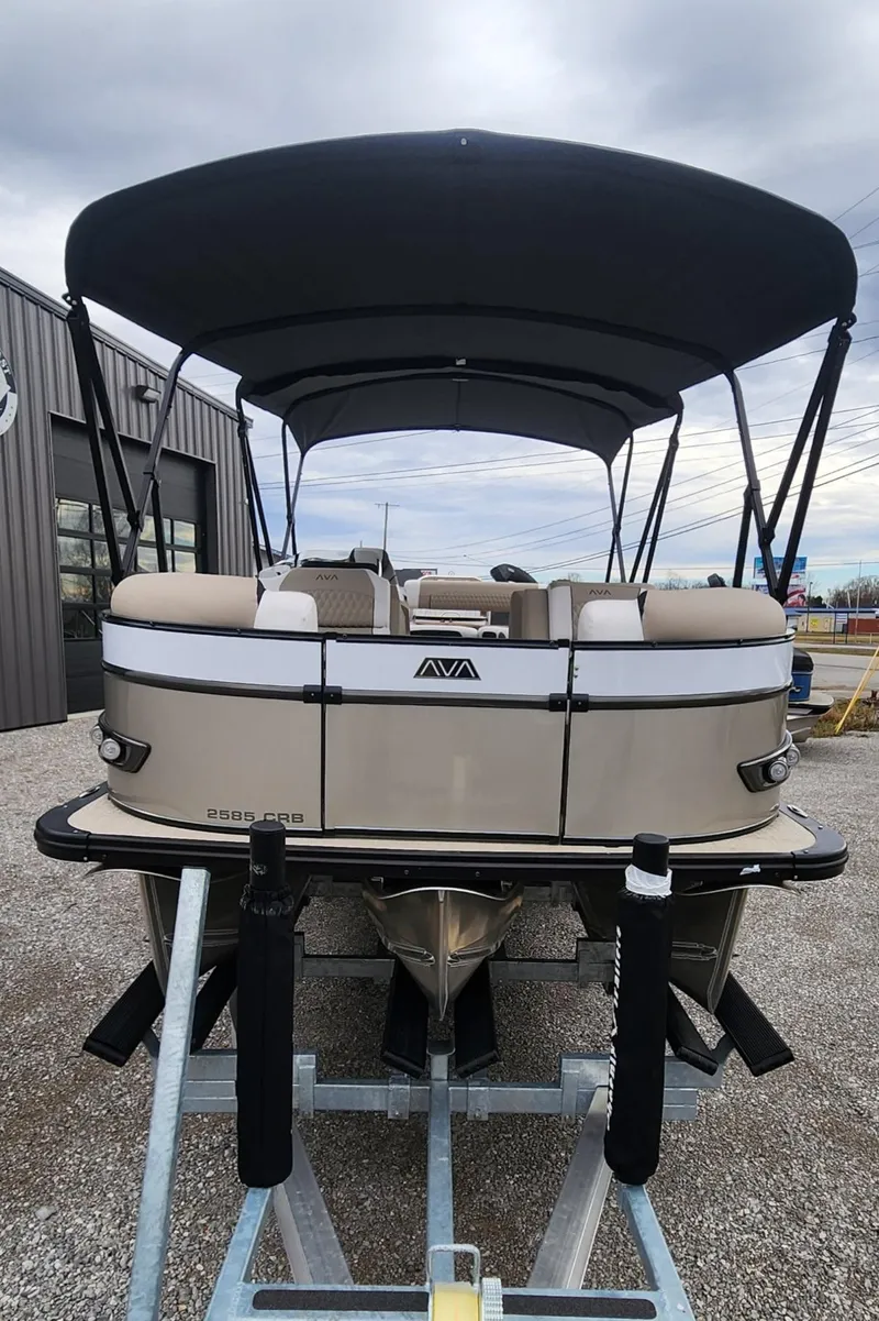 Slide: The Image of 2025 Avalon Platinum Catalina 2585 Cruise Rear Bench pontoon boat with canopy on display. - 2