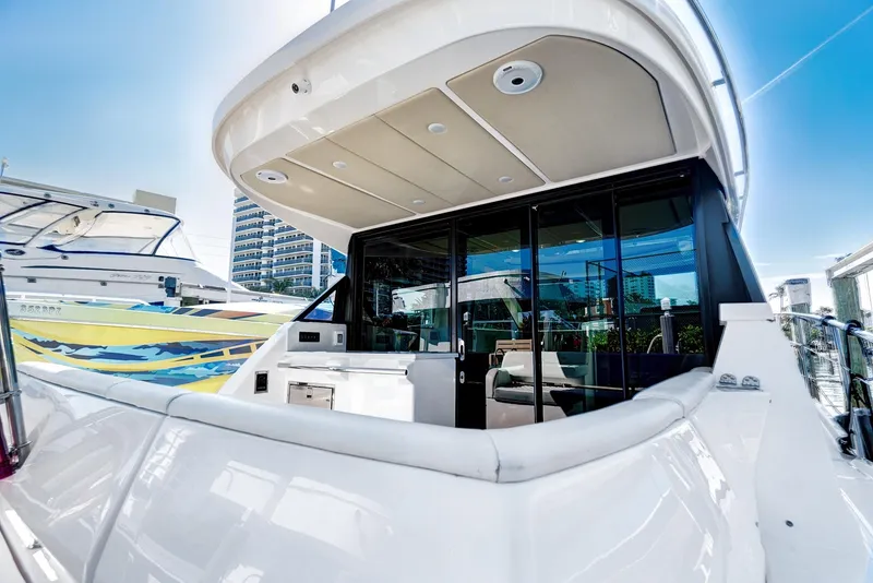 Slide: The Image of 2022 Regal 38 XO yacht with sleek design and modern amenities. - 13