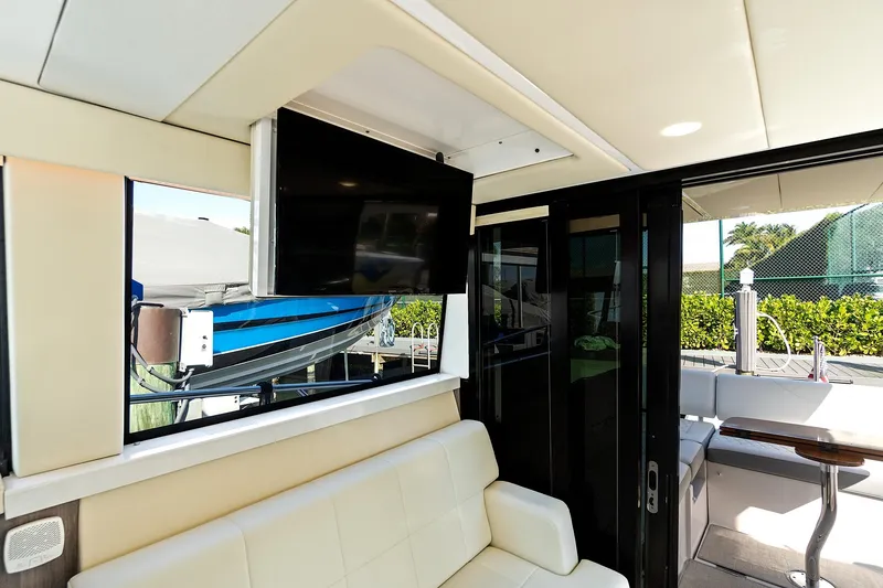 Slide: The Image of Interior of 2022 Regal 38 XO yacht with TV and seating area. - 21