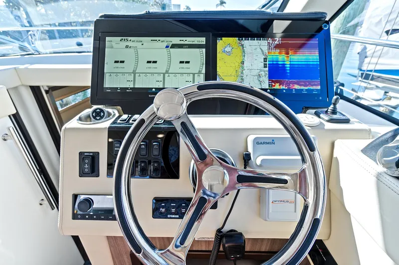 Slide: The Image of Helm of 2022 Regal 38 XO boat with advanced navigation displays. - 25