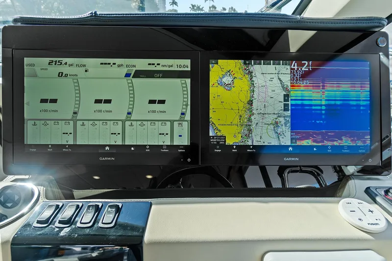 Slide: The Image of Dashboard of 2022 Regal 38 XO boat with navigation and control screens. - 27