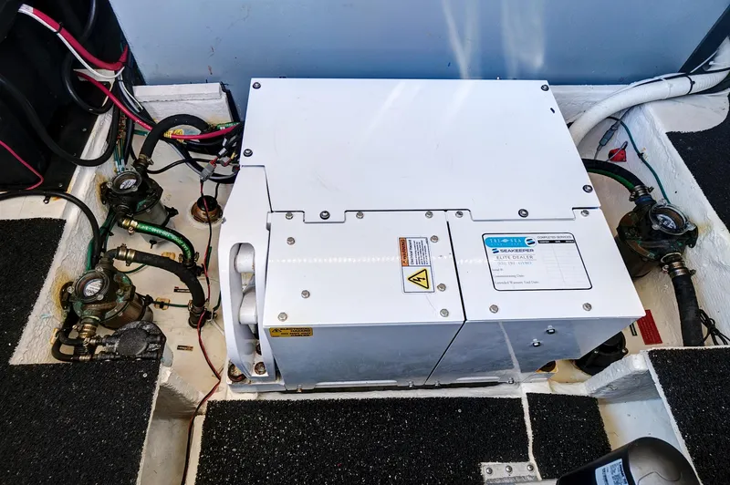 Slide: The Image of 2022 Regal 38 XO engine compartment with electrical components and wiring. - 40