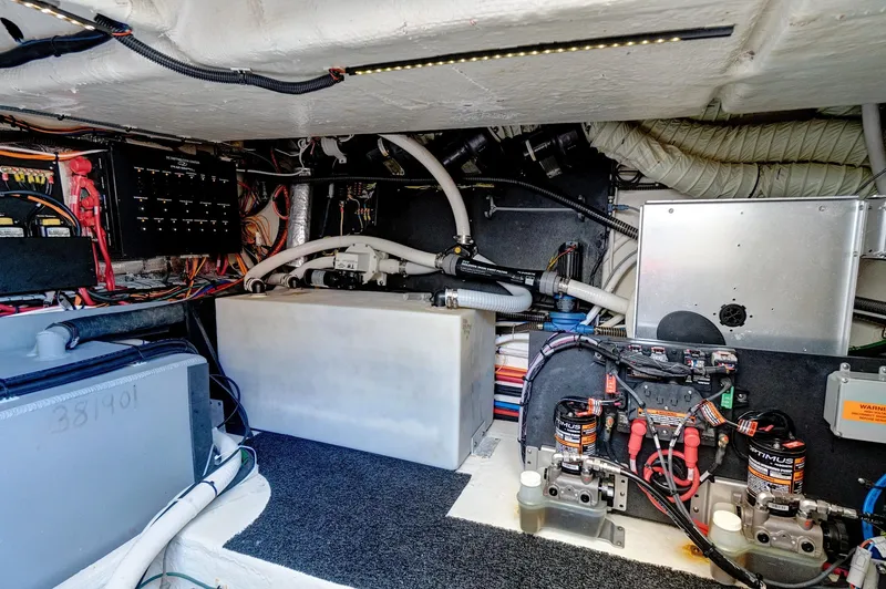 Slide: The Image of Engine room of 2022 Regal 38 XO boat, showcasing wiring and mechanical components. - 41
