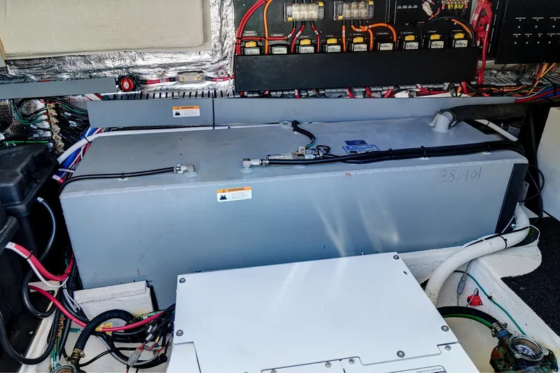 Slide: The Image of Engine compartment of 2022 Regal 38 XO boat, showcasing wiring and components. - 43