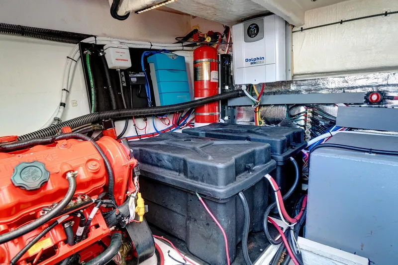 Slide: The Image of Engine room of 2022 Regal 38 XO yacht with visible components and wiring. - 45