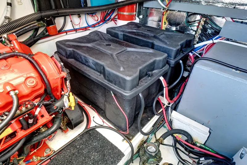 Slide: The Image of Engine room of 2022 Regal 38 XO with batteries and wiring. - 46