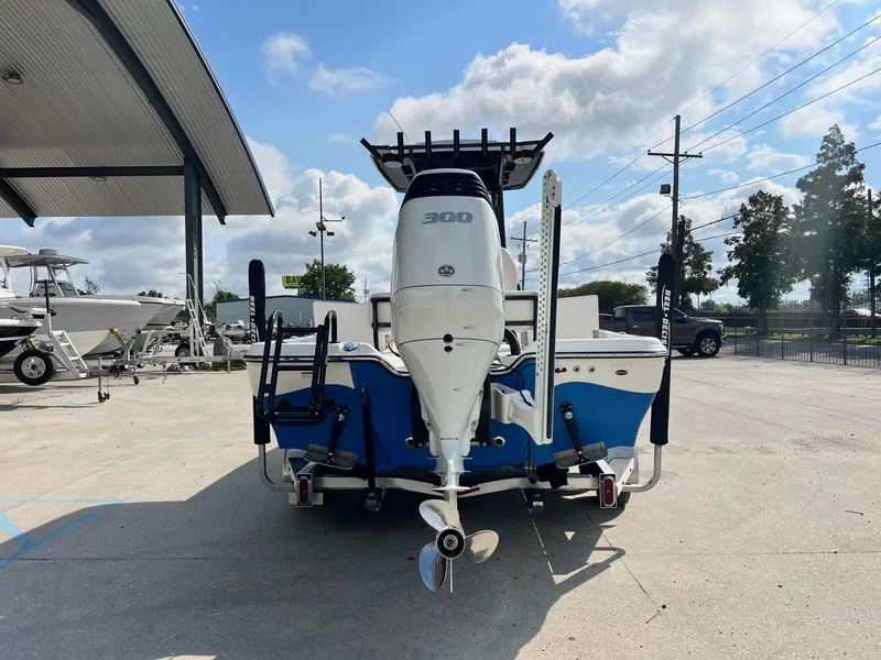 Slide: The Image of 2021 Blue Wave 2400 PURE BAY boat with powerful outboard motor in a sunny marina. - 12