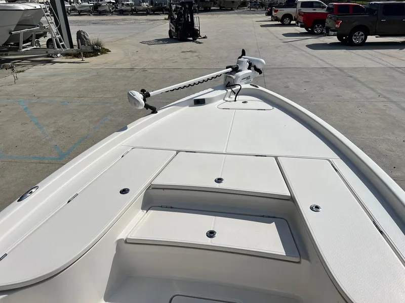 Slide: The Image of 2021 Blue Wave 2400 PURE BAY boat deck in a marina setting. - 7