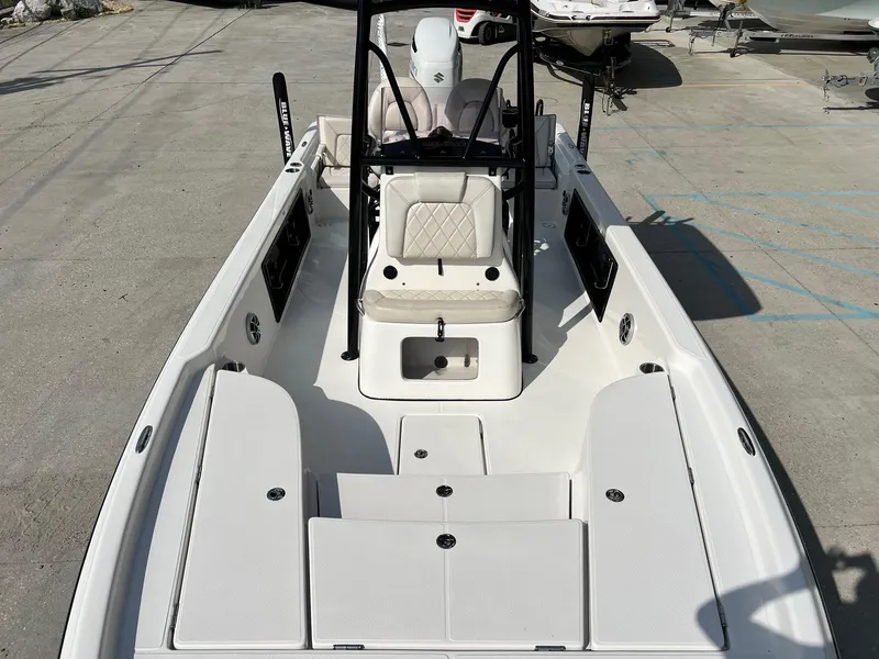 Slide: The Image of 2021 Blue Wave 2400 PURE BAY boat interior with seating and storage compartments. - 8