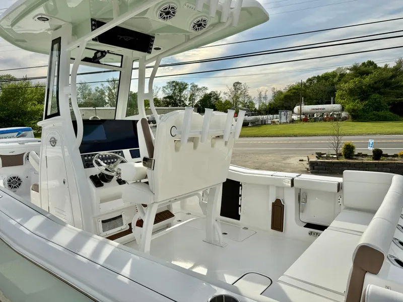 Slide: The Image of 2025 Tidewater 256 LXF boat interior with modern helm and seating. - 12