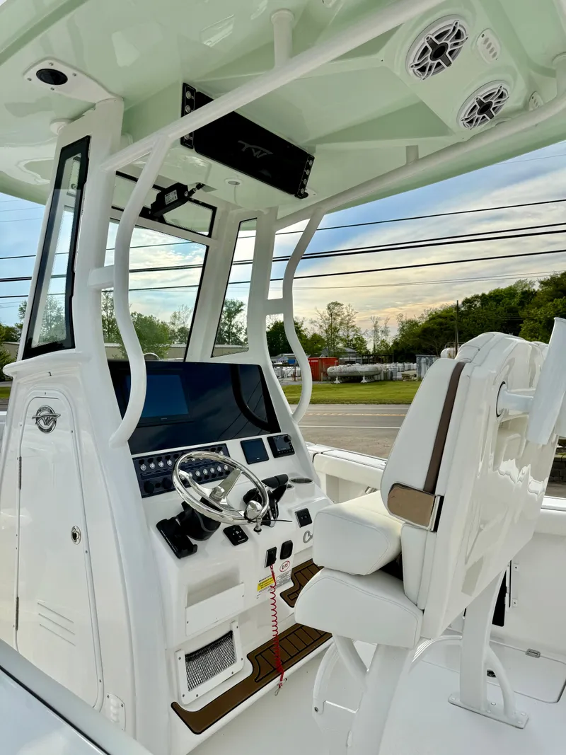 Slide: The Image of 2025 Tidewater 256 LXF boat cockpit with modern controls and seating. - 16