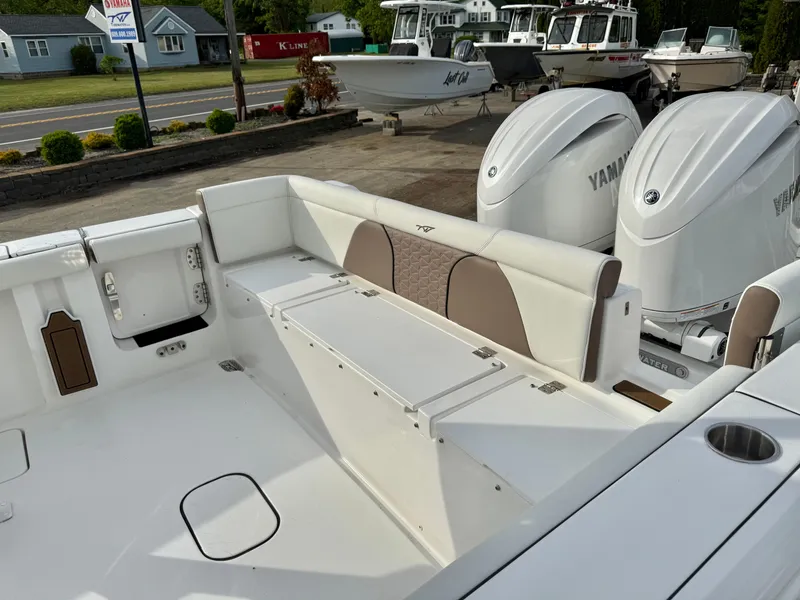 Slide: The Image of 2025 Tidewater 256 LXF boat with Yamaha engines, featuring spacious seating and modern design. - 21