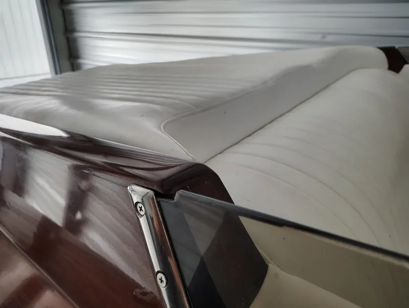 Slide: The Image of 1989 Kavalk Continental boat interior with white leather seats and wooden trim. - 12